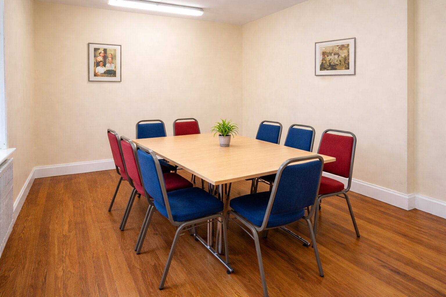 Meeting room with red and blue chairs